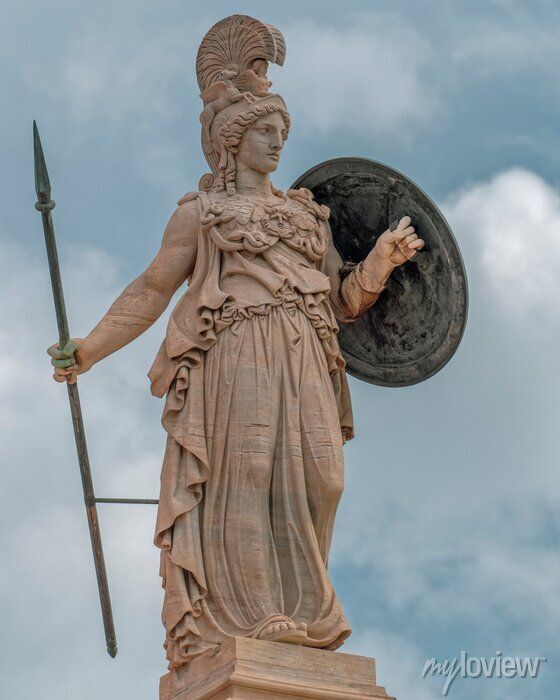 an ancient statue holding a shield and spear in front of a cloudy blue sky with white clouds