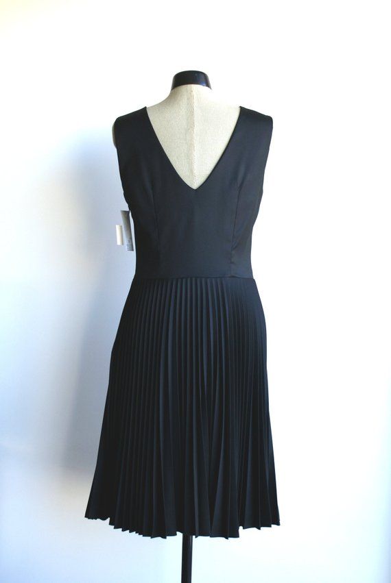 Black pleated dress. Sleeveless. Decorative folds on neckline. Zip on left side. With lining. Dress is made of black fabric.Size 38/8/S (bust 92cm/36,2in, waist 74cm/29,1in, hips 98cm/38,6in)Back lenght 105cm75%PL 25%Ray  2%EAlining 50%PL 50%RayDry cleaning Black Pleated Dress, Dress Sleeveless, Estonia, Dress Clothes For Women, Pleated Dress, Black Fabric, Little Black Dress, Dress Outfits, Vintage Fashion