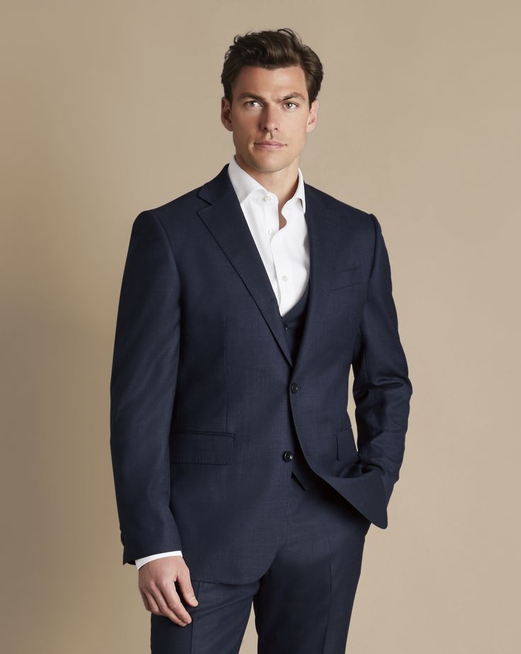 Super 120's woolmark certified pure merino wool, Natural stretch and crease recovery, Available in classic and slim fit, Body Lining: Exclusive Charles Tyrwhitt Lapwing 52% polyester, 48% viscose lining in navy, AMF stitching along notch lapel and flap pockets for a timeless finish, Half-canvas construction, Straight flap pockets, chest pocket and internal jet pockets - Ultimate Performance End-on-End Suit Jacket - Navy | Men's Charles Tyrwhitt Ultimate Performance End-On-End Suit Jacket - Navy Custom Fit Business Three-piece Suit, Fitted Winter Sport Coat In Suiting Fabric, Winter Fitted Sport Coat In Suiting Fabric, Fitted Timeless Outerwear In Suiting Fabric, Timeless Fitted Outerwear In Suiting Fabric, Slim Fit Business Outerwear In Suiting Fabric, Fitted Timeless Tweed Jacket For Business, Classic Slim Fit Outerwear In Suiting Fabric, Classic Slim-fit Three-piece Winter Suit