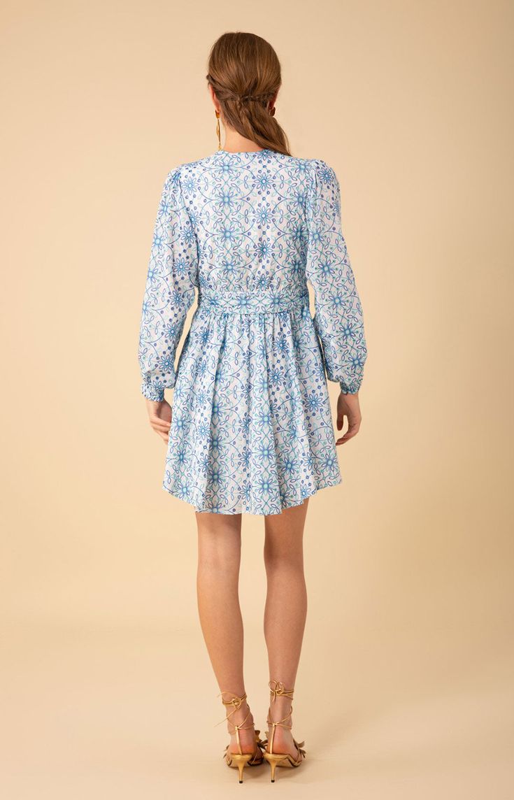 Eyelet
Body is lined 

Wrap dress ties at the side waist

Voluminous long sleeve with

smocked cuff

Swingy skirt

Mid- thigh length (34.5” HPS) Kehlani, Right To Privacy, Tie Dress, Blue Dresses, Wrap Dress, Bodice, The Dress, Top Brands, Long Sleeves