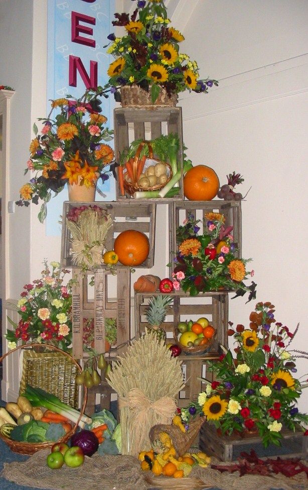 an arrangement of fruits and vegetables on display