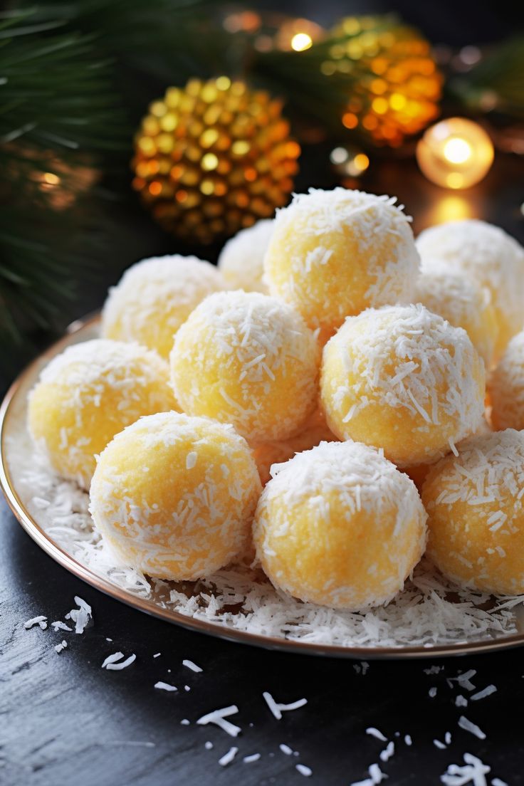 a plate full of coconut snowballs on a table