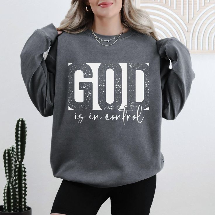 Comfort Colors® God Is in Control T-Shirt and Sweatshirt Reflect your faith with our "God Is in Control" Comfort Colors t-shirt and sweatshirt. Perfectly crafted for comfort and style, these garments are made from high-quality Comfort Colors fabric, offering a soft and relaxed fit. Whether you're wearing it to church, a casual outing, or simply as a daily reminder of your faith, this t-shirt and sweatshirt set is a meaningful addition to your wardrobe. **Product Details - **Design "God Is in Con Motivational Clothing, God Is In Control, Spiritual Shirts, Bible Verse Shirt, Jesus Shirt, Cricut Craft, Christian T Shirt, Sweatshirt Set, Jesus Shirts