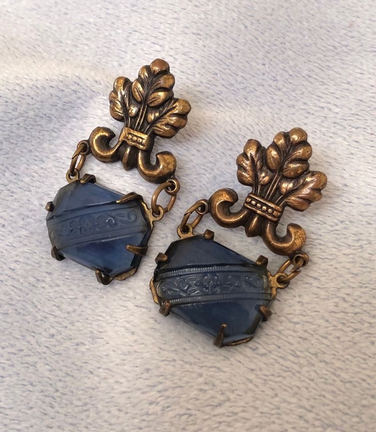 "Hello and Welcome to LiamBySevanna! Prior-purchasing any listing from this shop, please Ask question/s, Request additional photos, to make sure the listed item, is the right choice for you! Per our store policy we don't accept returns Listing is for: Vintage Floral Etched Blue Glass De lis Drop Bronze Earrings. unmarked for any makers brand. Drop length is 1-3/8 inch by 3/4 inch wide at the bottom.  Reminder: You can \"always\" prevent any wrong purchase/s by Communicating, Inquiring and Questioning Prior making any Purchase! We provide pictures and share any info known about the listing accordingly. Don't assume, please ask. Thank you Kindly." Blue Vintage Earrings For Formal Occasions, Formal Glass Drop Earrings, Glass Drop Earrings For Formal Occasions, Handmade Blue Evening Earrings, Vintage Blue Earrings For Formal Occasion, Ornate Blue Earrings For Formal Events, Ornate Blue Earrings For Formal Occasions, Victorian Blue Earrings For Formal Occasions, Vintage Blue Earrings For Evening