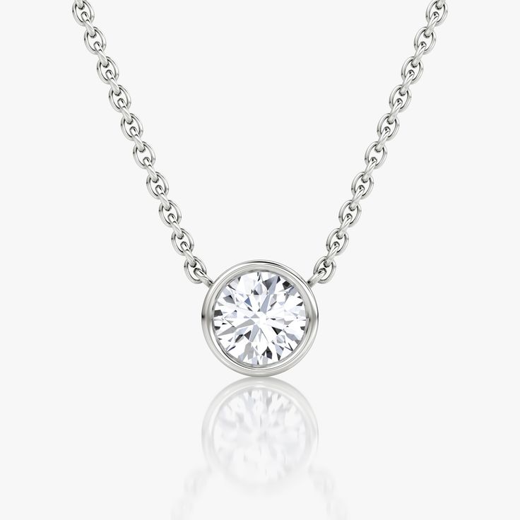 Bezel Solitaire Necklace | VRAI Luxury Everyday Jewelry With Smooth Bezel, Timeless White Gold Solitaire Necklace, Timeless Silver Solitaire Necklace, Timeless Solitaire Necklace For Anniversary, Timeless Platinum Solitaire Necklace, Timeless Sterling Silver Solitaire Necklace With Single Diamond, Classic Jewelry With Bezel-set Round Stone, Classic Jewelry With Bezel Set Round Stone, Classic White Jewelry With Bezel Setting