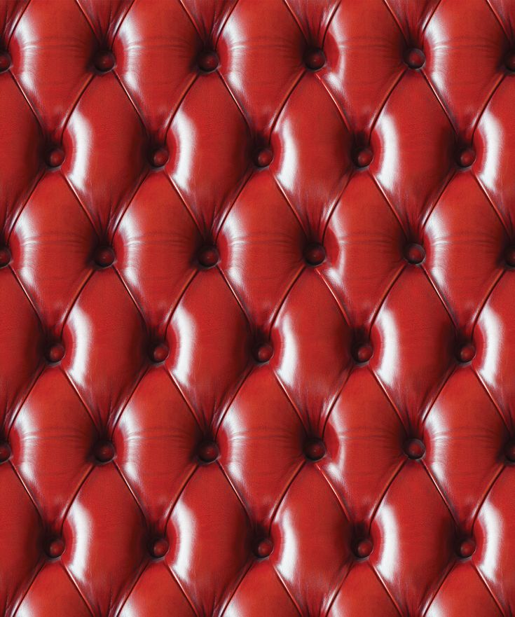 a red leather upholstered wall with buttons