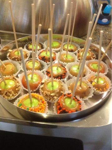 there are many desserts on the tray ready to be served in the buffet room