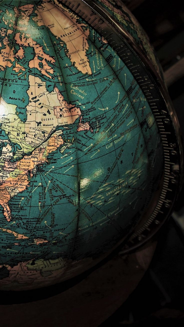 an old world globe sitting on top of a table