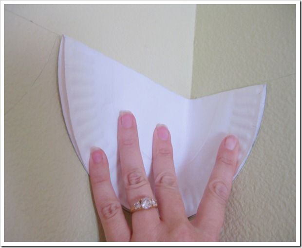 a woman's hand on top of a piece of paper with a diamond ring