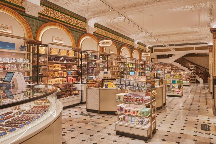 a store filled with lots of different types of food and desserts on display next to each other