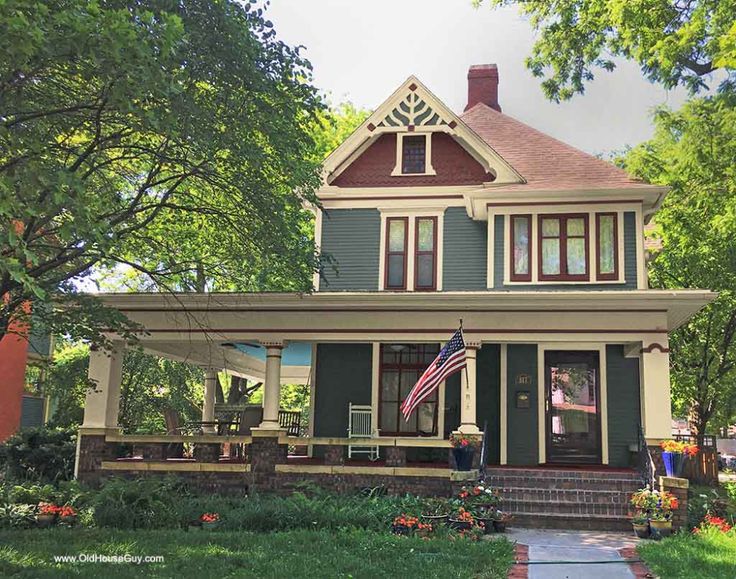 a house with an american flag on the front porch