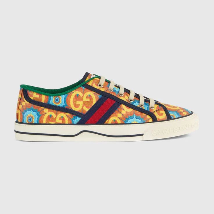 During Its 100 Years, Gucci Has Established Itself As One Of The Most Influential Fashion Houses. In Honor Of The Centennial, This Gucci Tennis 1977 Sneaker Celebrates The House's Whimsical Nature With A Colorful Print That Mixes Circles And Ggs To Create A Playful Kaleidoscope Effect. A Leather Detail With The Gucci Script Logo On The Inner Sole Adds An Unexpected Element To The Style. Gucci 100 Tennis 1977 Sneaker Blue/Orange Red/Blue Signature Web Men's: 9, 9.5 Women's 11, 11.5 Product Number Blue Gucci Sneakers With Branded Insole, Blue Lace-up Gucci Sneakers, Blue Low-top Gucci Sneakers, Blue Gucci Low-top Sneakers, Designer Blue Gucci Sneakers, Gucci Casual Blue Sneakers, Designer Orange Sneakers, Gucci Multicolor Sneakers With Rubber Sole, Multicolor Gucci Sneakers With Rubber Sole