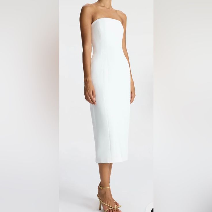 The Elizabeth Dress, A Part Of A.L.C.'S Signature Collection, Is Impeccably Cut From Structured Winter White Fabric. This Midi Silhouette Is Strapless, Featuring Pockets And Darted Seams For A Feminine Fit. We Recommend To Size Up One From Your Typical Size White Knee-length Strapless Formal Dress, Spring Dinner Dress With Straight Neckline, Fitted Midi Strapless Dress For Dinner, Fitted Midi Length Strapless Dress For Dinner, Fitted Strapless Midi Dress For Dinner, Summer Midi Dress With Straight Neckline For Dinner, Spring Strapless Midi Dress For Dinner, Summer Strapless Fitted Dinner Dress, Chic Strapless Dress With Fitted Bodice For Dinner