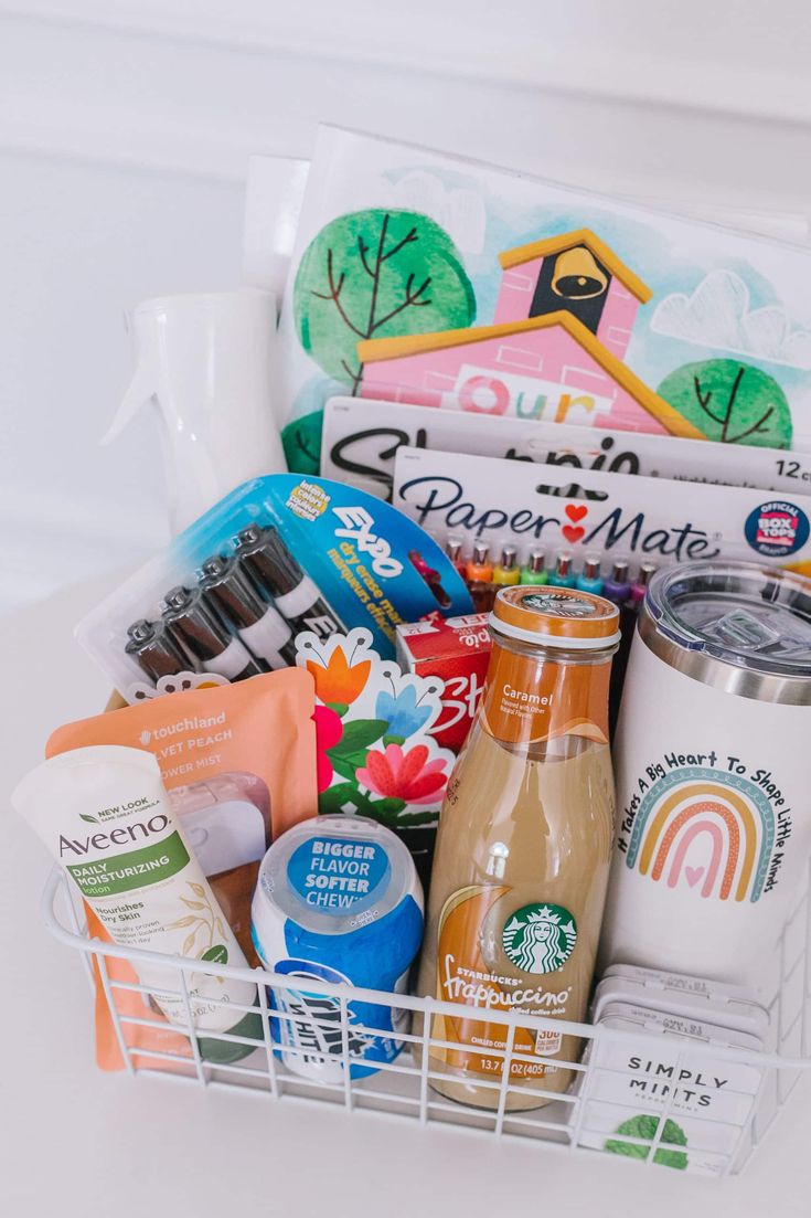 a white basket filled with lots of different types of food and condiments on top of a table