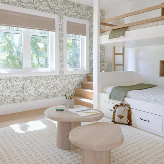 a bedroom with bunk beds and white furniture