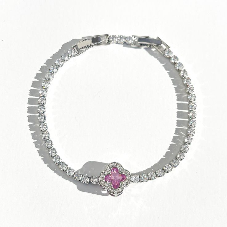 Elevate your wrist game with our stunning Diamond Clover Tennis Bracelet. Each CZ diamond sparkles with brilliance, creating a dazzling effect that catches every eye. The addition of the lucky clover charm brings a touch of whimsy and positivity to your style. Perfect for adding a dash of glamour to both casual and formal looks. Shine bright with this unique and charming accessory. Silver plated Water/tarnish resistant 7-8in adjustable Silver Cubic Zirconia Bracelets As Gift For Her, Crystal Diamond Bracelet Gift In Fine Jewelry Style, Diamond Jubilee Bracelet In Crystal For Gift, Gift Crystal Diamond Bracelet With Jubilee Design, Gift Diamond Jubilee Bracelet In Crystal, White Diamond Crystal Bracelet As Gift, White Sparkling Diamond Bracelet As Gift, White Gold Cubic Zirconia Charm Bracelet, Sparkling White Diamond Bracelet As A Gift