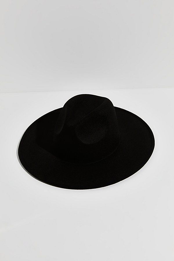 So simple yet chic, this effortlessly cool hat is featured in a structured style and soft wool-blend with a teardrop-shaped crown and wide brim. | Clean Slate Felt Hat by Free People in Black Chic Curved Brim Felt Hat For Winter, Chic Felt Hat With Curved Brim For Winter, Chic Winter Felt Hat With Curved Brim, Modern Curved Brim Felt Hat For Fall, Modern Felt Hat With Curved Brim For Fall, Chic Wool Fedora With Flat Brim, Modern Fedora Hat For Fall, Modern Wide Brim Felt Hat For Winter, Modern Black Brimmed Hat