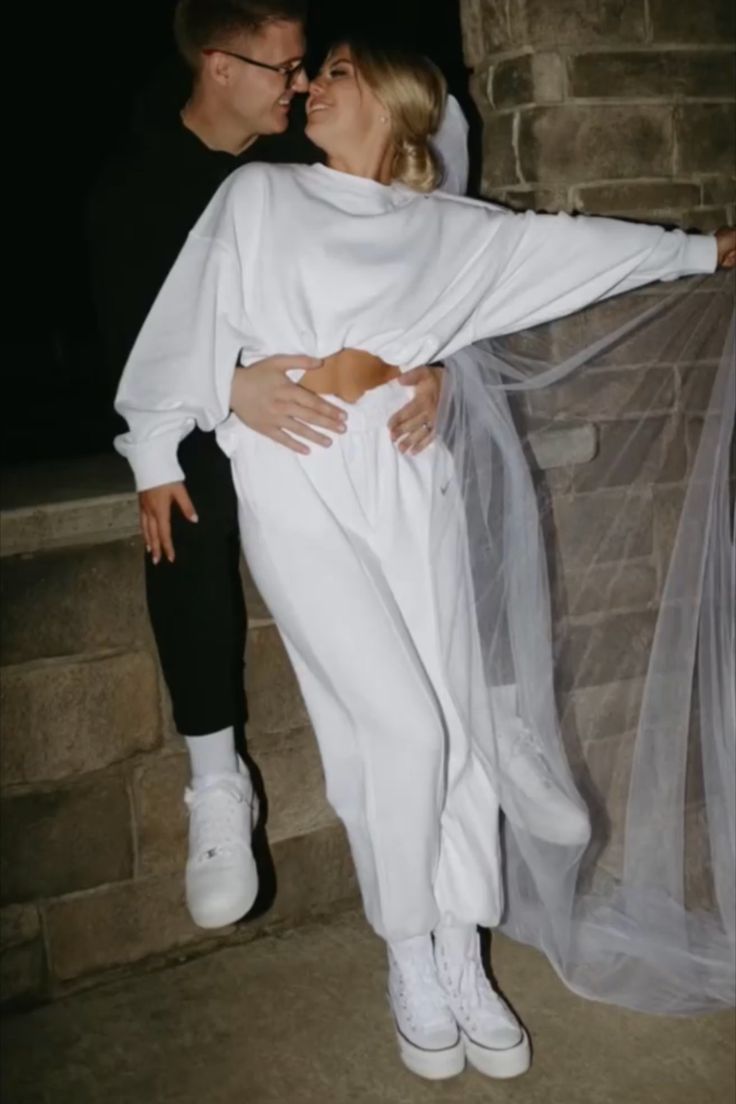 a man and woman dressed in white posing for a photo with the caption pov you spice things up after your ceremony