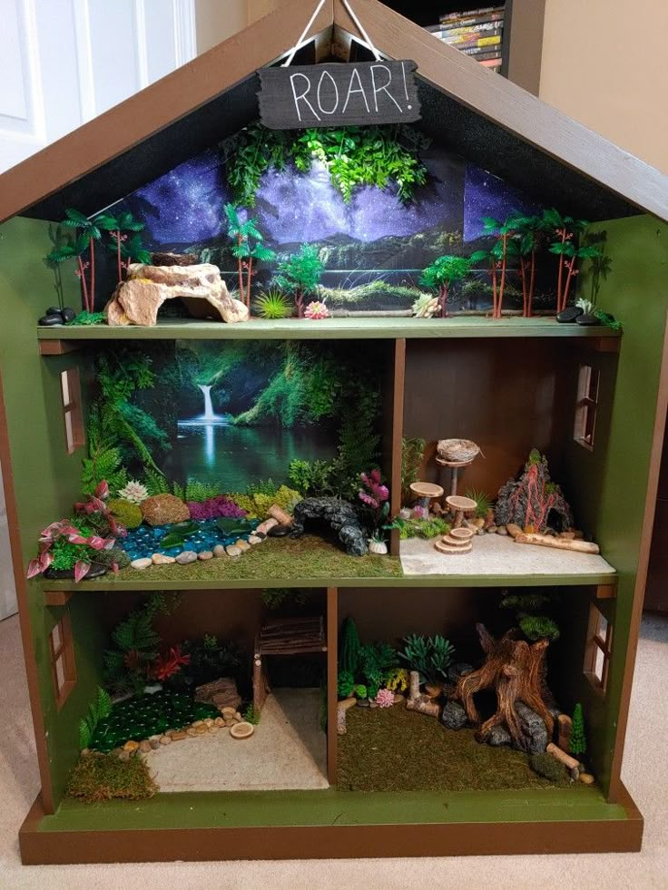 a doll house made to look like a forest scene