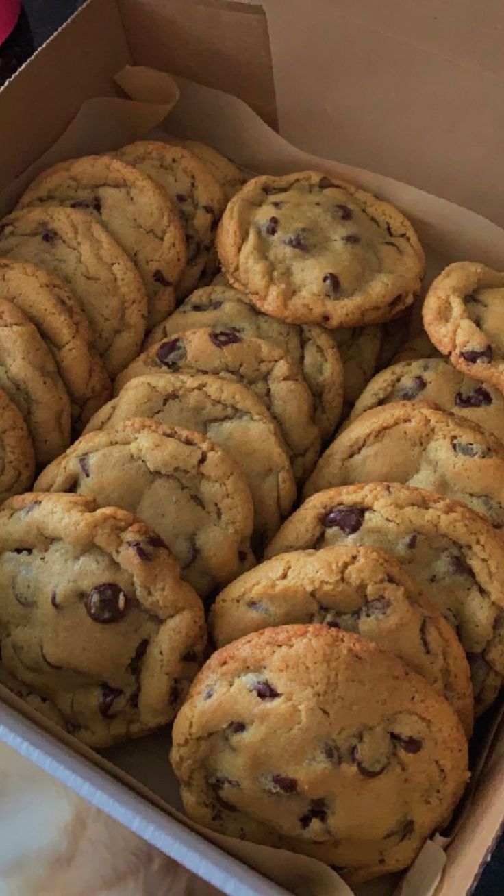 a box full of chocolate chip cookies on a table