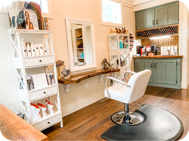 a salon chair sitting in front of a counter with bottles on top of it next to a window