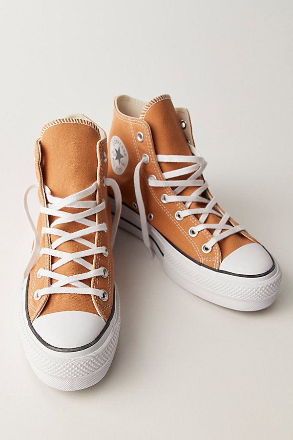 The high-top Converse sneakers you know and love with a lifted upgrade, featuring a chunky platform sole, while staying true to the brand’s iconic style. * Lace-up closures * Cushioned insole * Slim-fitting style | Chuck Taylor All Star Lift Hi-Top Sneaker by Converse at Free People in Brown, Size: US 6 Taupe Converse, Converse Hightop Platform, Converse High Tops With Leggings, Platform Chuck Taylors, Converse High Tops Platform, Converse Platform Shoes, Chuck Taylors Outfit, Converse Leather High Tops, Hawaii Living