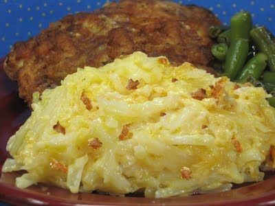 a plate with mashed potatoes, green beans and hash browns on it is shown