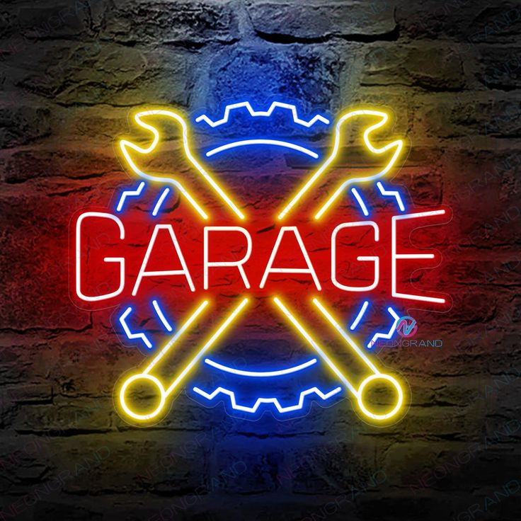 a neon sign that says garage with two wrenches