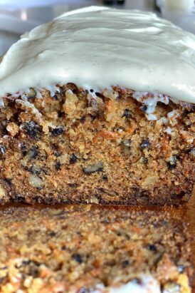 a loaf of carrot bread with cream cheese frosting