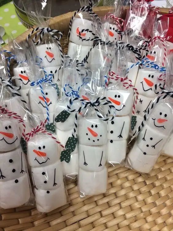 snowmen are wrapped in plastic bags and tied with twine on the handles to make them look like they're ready for christmas