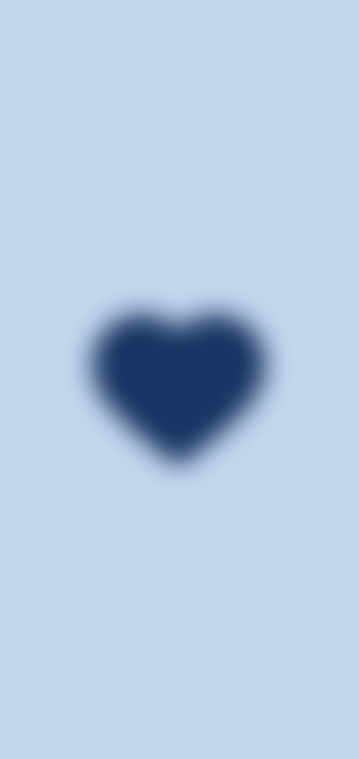 a blue heart shaped object on a light blue background