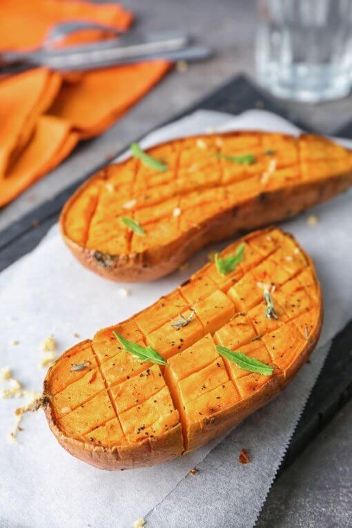 two pieces of bread sitting on top of a piece of paper