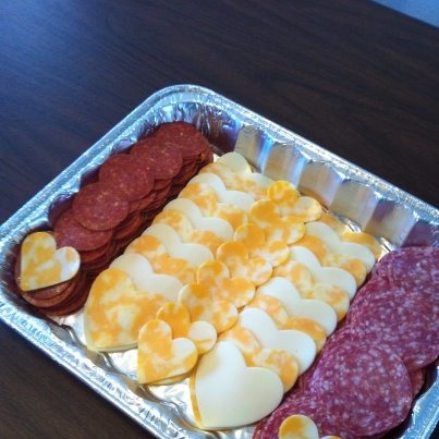 a metal tray filled with different types of food