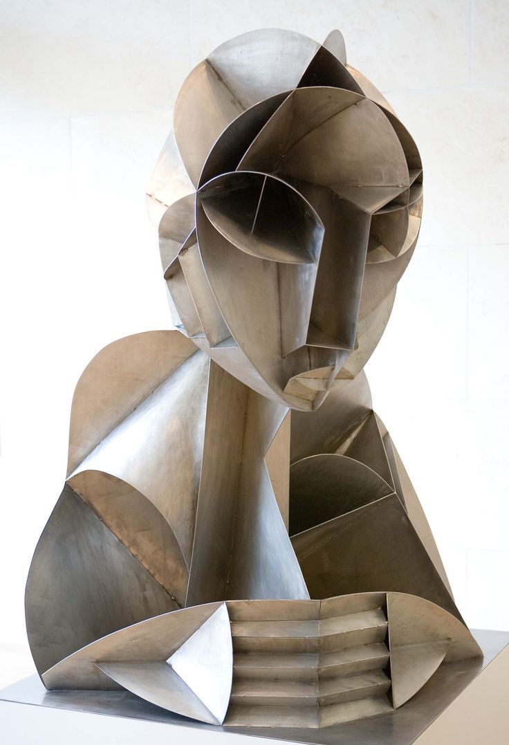 an abstract sculpture is displayed on a white surface with no one around it and the image appears to be made out of metal