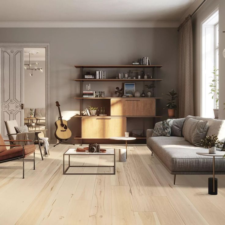 a living room filled with furniture and a guitar on the wall next to a window