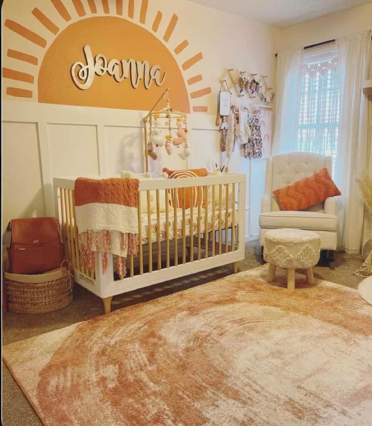 a baby's room with an orange and white theme