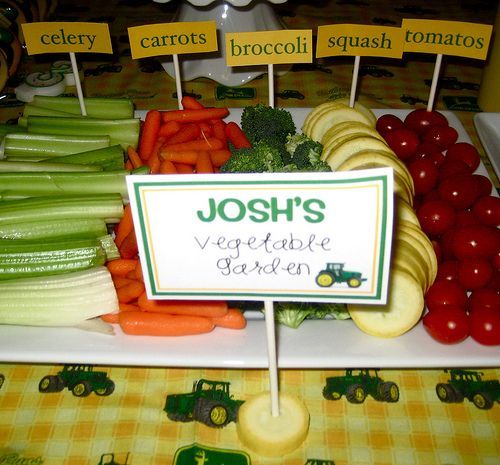 a table topped with lots of veggies and carrots