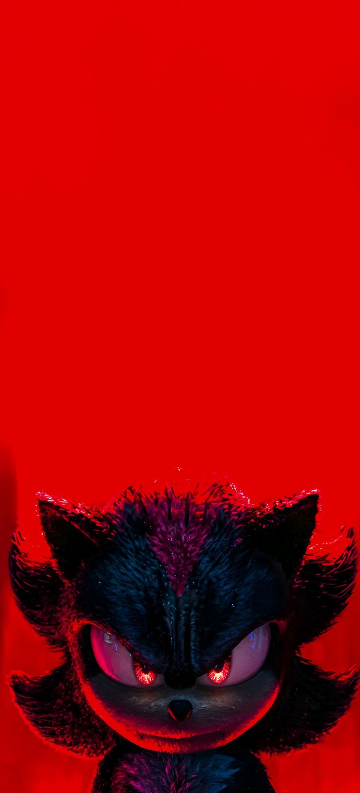 an evil looking cat with red eyes and black fur on it's head, standing in front of a red background