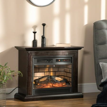 a living room with a chair and a fire place in the corner on the floor