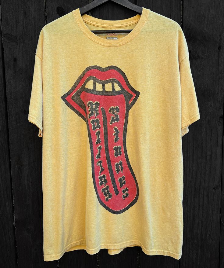 Rolling Stones tongue graphic on thin and soft tee. New print on recycled and dyed tee. Cotton. Marked size XL. Please check measurements below to ensure fit! Measurements taken flat across tee: Bust: 24" Length: 30.5" FREE DOMESTIC SHIPPING! *This is a pre-loved shirt that has been renewed, imperfections are noted as best as possible but please keep in mind that this is a one of a kind item and not identically mass-produced* [All sales final unless grossly misrepresented] New Print, Rolling Stones, Labour Day, Gender Neutral, Bathing Beauties, Im Not Perfect, Angeles, Adult Outfits, Tops & Tees