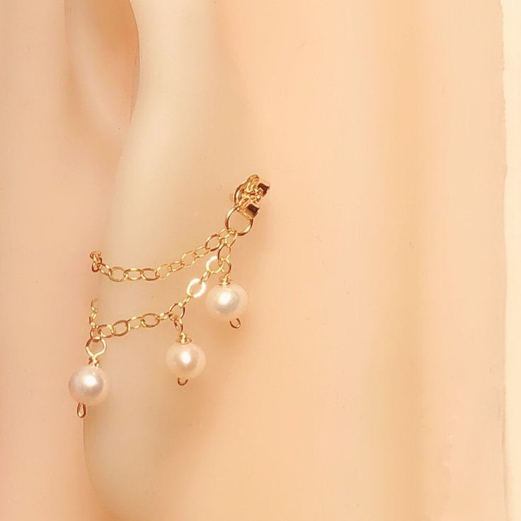 ♥Simply♥Dainty♥Everyday♥Minimal♥ 14k gold/rose gold filled pin/chains/butterfly back 925 sterling silver pin/chain/butterfly back Post gauge: 20 gauge Freshwater pearls Price for one earring ---------------------------------------------------------- 14k gold filled Anyone who can wear gold can wear gold filled without worries of any allergic reaction to the jewelry. Gold filled jewelry is an economical alternative to solid gold! ---------------------------------------------------------- 100% han Dainty 14k Gold Ear Cuff, Dainty Rose Gold Ear Cuff, Dainty Gold-plated Ear Cuff, Dainty Dangle Cartilage Earrings For Wedding, Dainty 14k Gold Filled Dangle Cartilage Earrings, Gold Dainty Cartilage Earrings With Delicate Chain, Dainty Gold Plated Hypoallergenic Ear Cuff, Delicate Gold Cartilage Earrings, Dainty Gold Cartilage Earrings With Delicate Chain