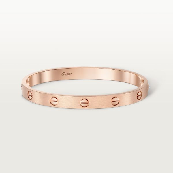 Cartier - LOVE Bracelet, Brushed Finish - Bracelet Gold - LOVE bracelet, 18K rose gold (750/1000), brushed finish. Comes with a screwdriver. Width: 6.1 mm. Created in New York in 1969, the LOVE bracelet is a jewelry design icon: a close fitting, oval bracelet composed of two rigid arcs, which is worn on the wrist and removed using a special screwdriver. The closure is designed with two functional screws placed on either side of the bracelet: you will need help to open or close it. To determine t Oval Bracelet, Trinity Bracelet, Trinity Necklace, Cartier Earrings, Cartier Necklace, Trinity Ring, Bracelet Rose Gold, Love Bracelet, Design Icon