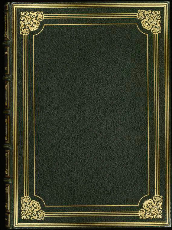 an old book with gold trimmings and a green cover on the front page