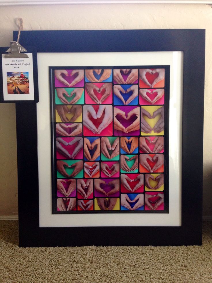 an art piece with many different colors and shapes on display in a black box frame