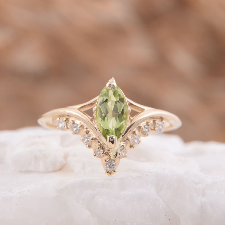 "Vintage style victorian womens wedding ring, Antique 14k solid yellow gold marquise cut green peridot engagement ring, Promise ring for her WE OFFER UNLIMITED PERIOD INSTALLMENTS PLAN This is a beautiful, stunning, feminine ring that works well for all occasions, styles, and ages. You will love it! Ring information Main stone: Peridot Approximate size: 8x4mm Accent stones: White cubic zirconia Approximate size: 1.5mm (5 stones) Approximate size: 1.25mm (4 stones) Metal type: Gold Metal stamp: 1 Marquise Cut Diamond Ring For May Birthstone, Green Marquise Diamond Ring Fine Jewelry, Gold Marquise Wedding Ring With Accent Stones, Elegant Peridot Promise Ring, Heirloom Green Marquise Cut Rings, Exquisite 14k Gold Marquise Ring, Green Marquise Diamond Promise Ring, Green Marquise Diamond Ring, Elegant Peridot Diamond Ring