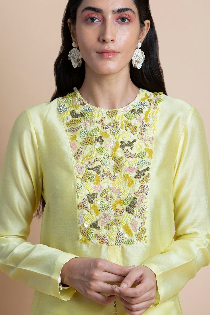 Editor's Note Featuring a lime yellow hand embroidered tunic in chanderi. Color: Yellow Fabric: Chanderi Care: Dry Clean Only Customize Your OutfitCan't find the size you're looking for? No stress. Just select the size "Custom" while adding the item to your cart. We will follow up with you for your body measurements. To request a color or design customizations, please contact our customer care by using our "Ask us a question" form or simply email us.About the Designer Saksham & Neharicka make mo Hand Embroidered Tunics, Yellow Kurta, Kaftan Designs, Kurta For Women, Embroidery On Kurtis, Lime Yellow, Kurti Embroidery Design, Hand Embroidery Patterns Flowers, Embroidered Neckline