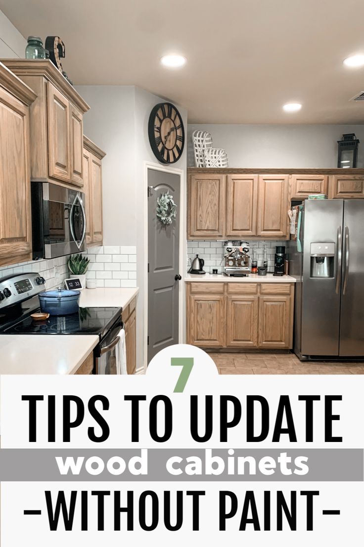 a kitchen with wood cabinets and white counter tops, the words 7 tips to update wood cabinets without paint