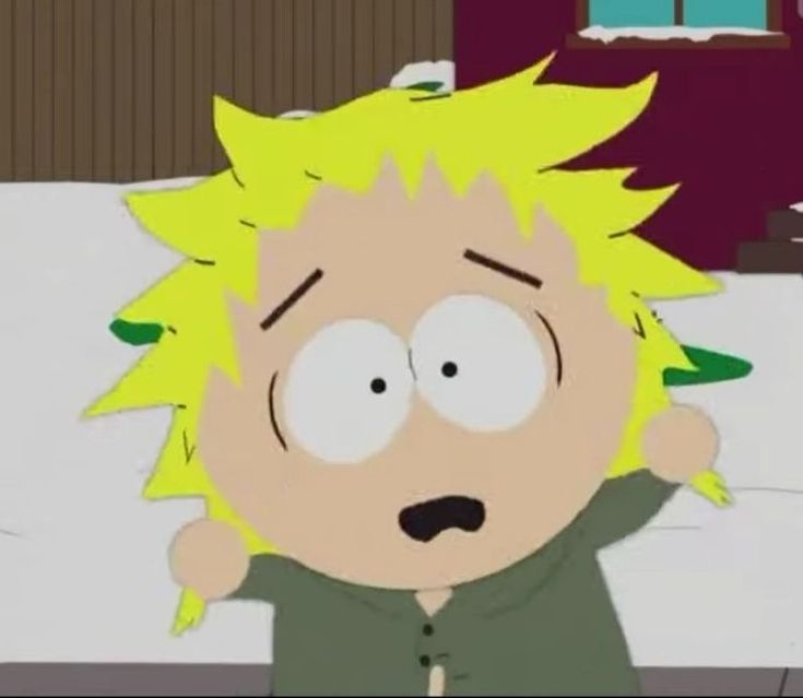 an animated image of a man with yellow hair and green shirt on in the middle of a bed