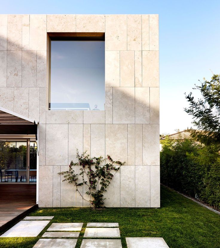 an outdoor area with grass and stepping stones