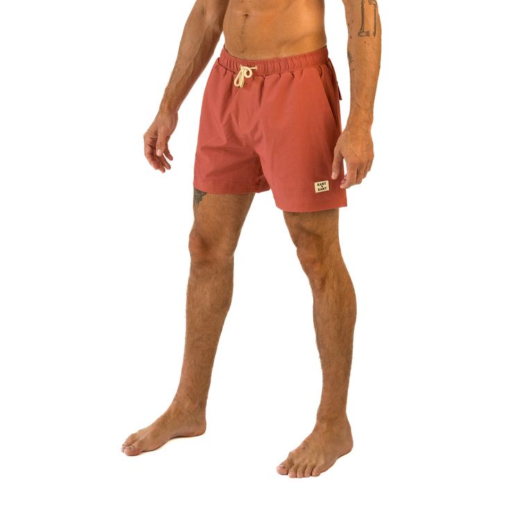 Get ready to embrace the tropical vibes with East x East Papaya swim shorts. These swim trunks feature a stunning rustic orange color inspired by the juicy and vibrant papaya fruit. Perfect for lounging on the beach or taking a dip in the ocean, these swim shorts are made with premium sustainable materials for both style and eco-friendliness. The elasticated waistband and drawstring adjustment ensure a comfortable and secure fit for all-day wear. With their unique and eye-catching design, our Pa Orange Swim Trunks With Built-in Shorts For Beach, Orange Beachwear Swimwear With Built-in Shorts, Orange Shorts For Beach Vacation, Orange Shorts For Beach Season Vacation, Orange Shorts For Vacation Beach Season, Orange Beach Shorts With Built-in Shorts, Orange Beach Shorts With Built-in Liner, Orange Beachwear Shorts For Beach Season, Tropical Cotton Shorts For Beach